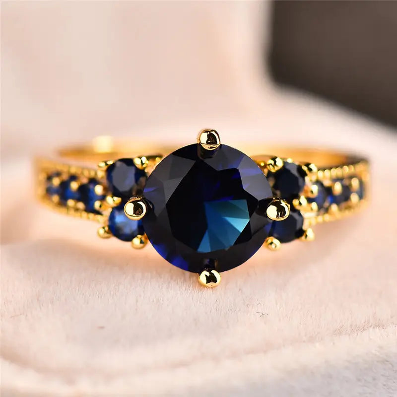 Anello Stella dorato con pietra blu