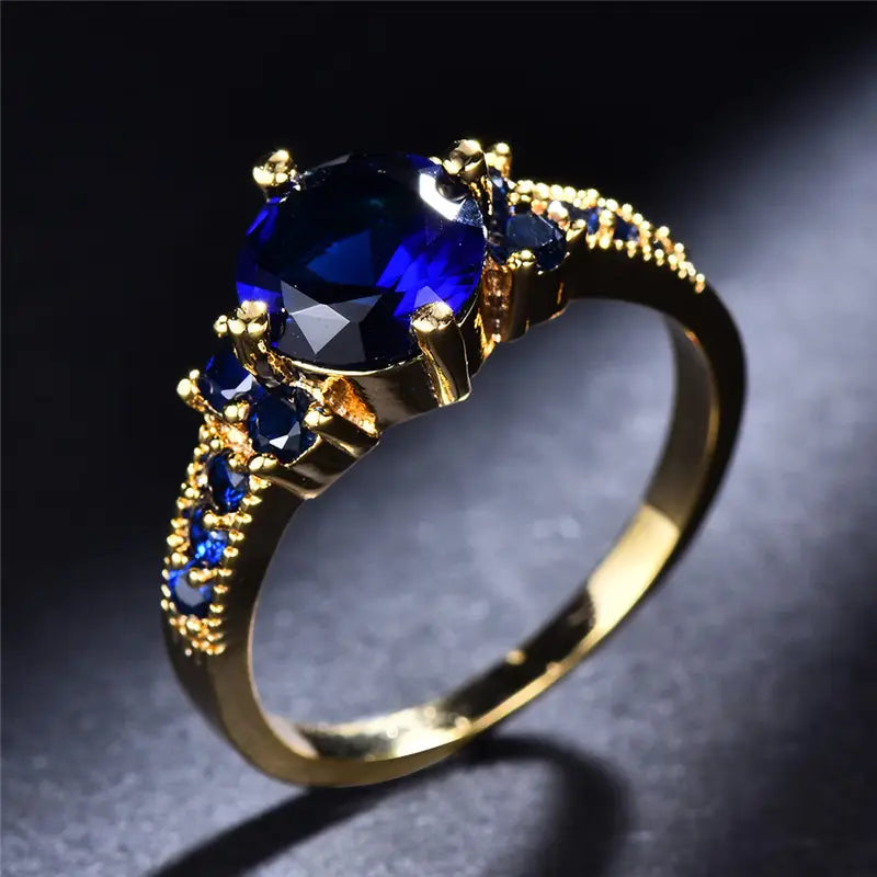 Anello Stella dorato con pietra blu