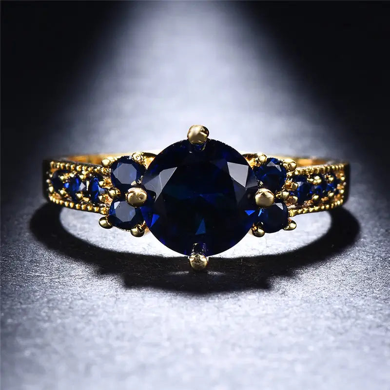 Anello Stella dorato con pietra blu
