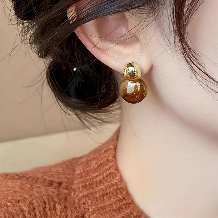 Orecchini pendenti con ambra | Oro