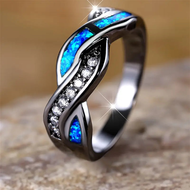 Anello con zaffiro nero e blu | Oro bianco