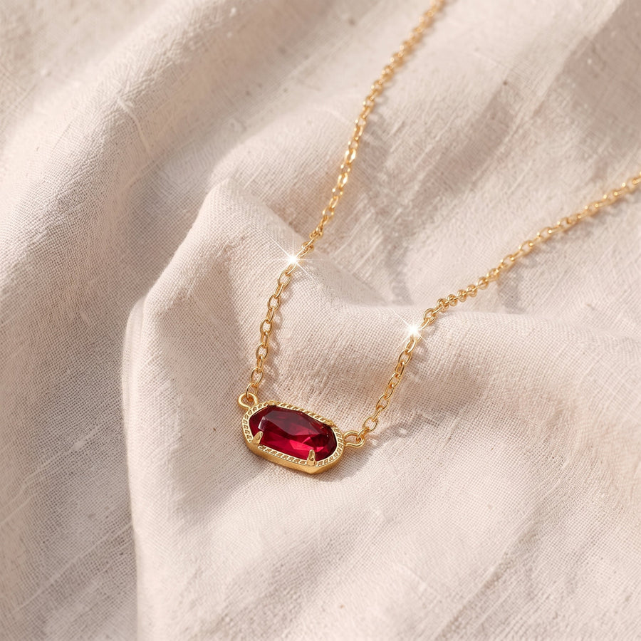 Collana classica dorata con pietra ovale rosso rubino