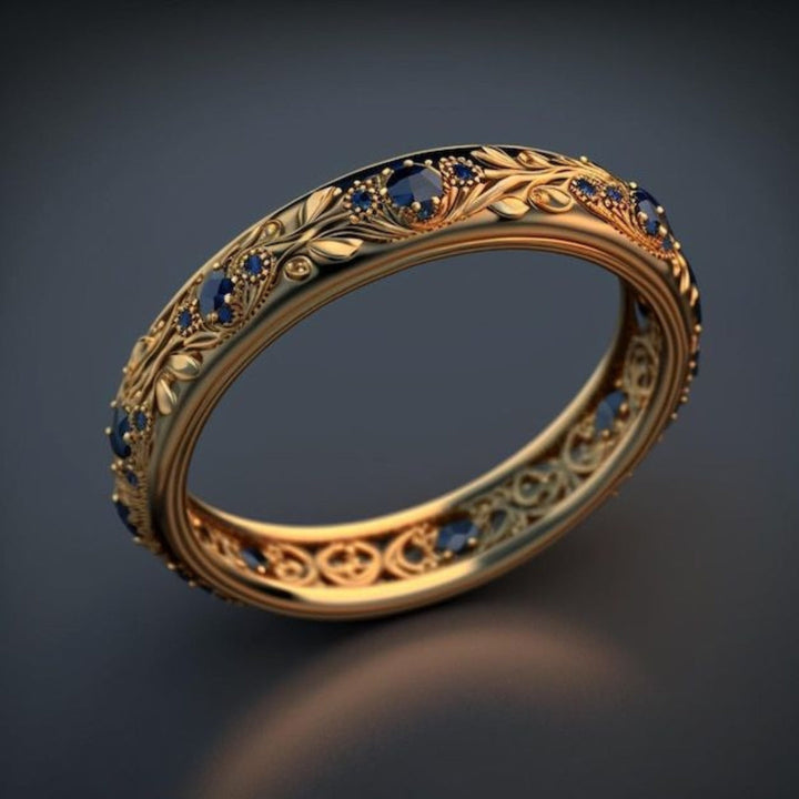 Anello delicato con zirconi blu a forma di foglia