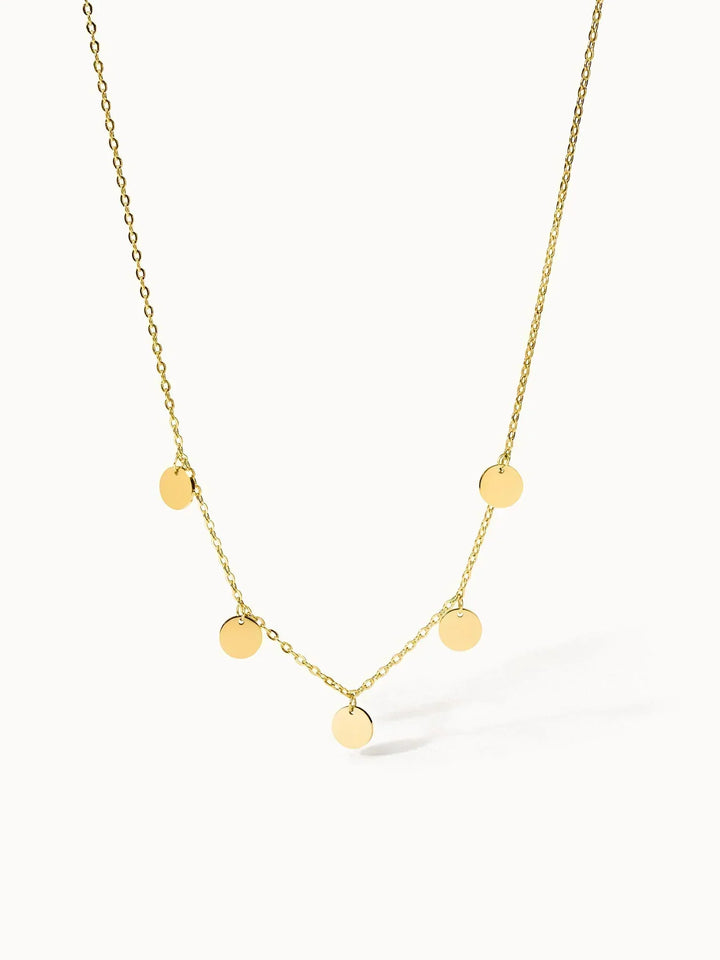 Collana dorata delicata con dischi multipli