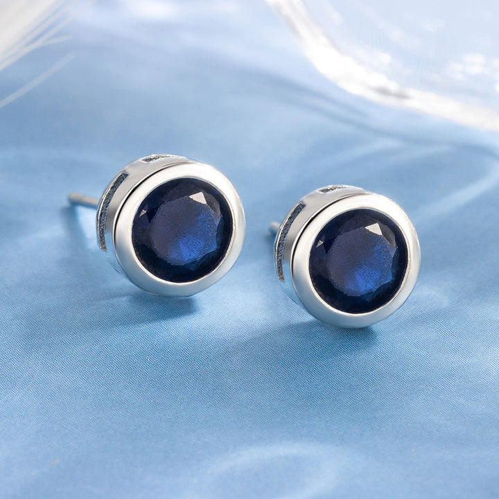 Orecchini a bottone con incastonatura a baguette | Colore argento