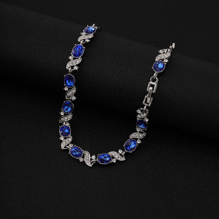Bracciale tennis con zaffiro ovale e vortice di cristallo