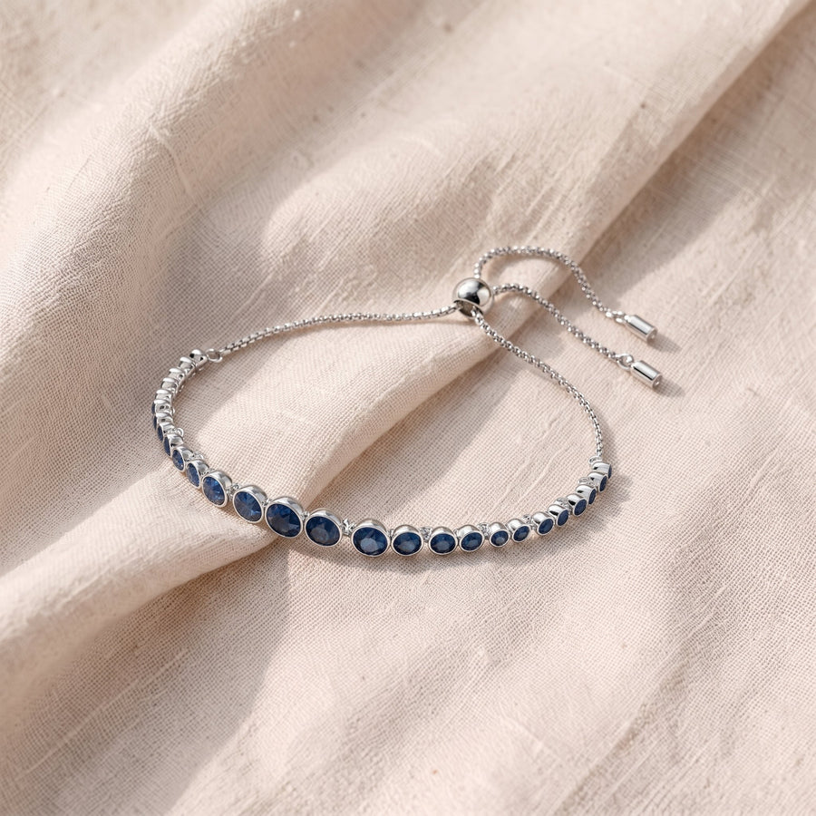Bracciale tennis argentato con pietre blu zaffiro tonde