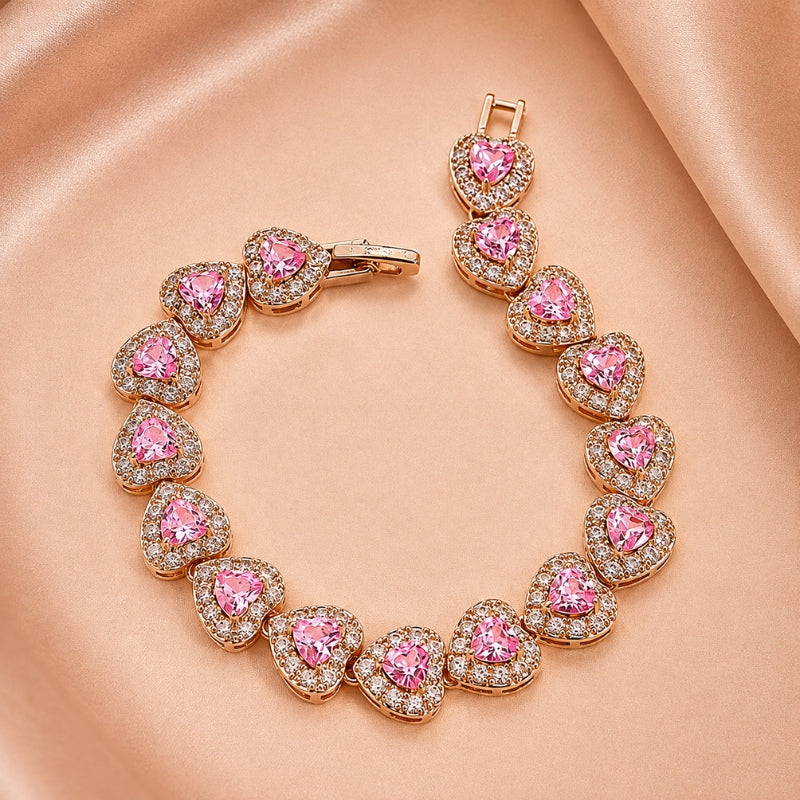 Bracciale dorato con cuore rosa brillante