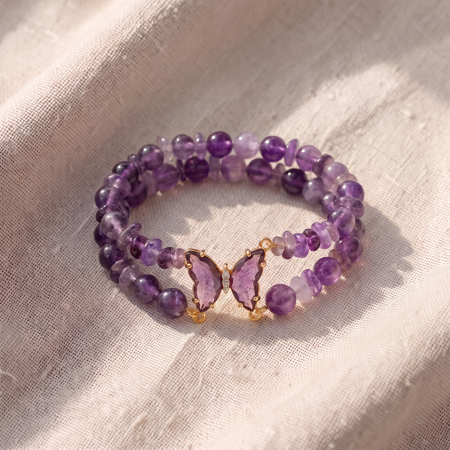 Set di bracciali di perle con farfalle