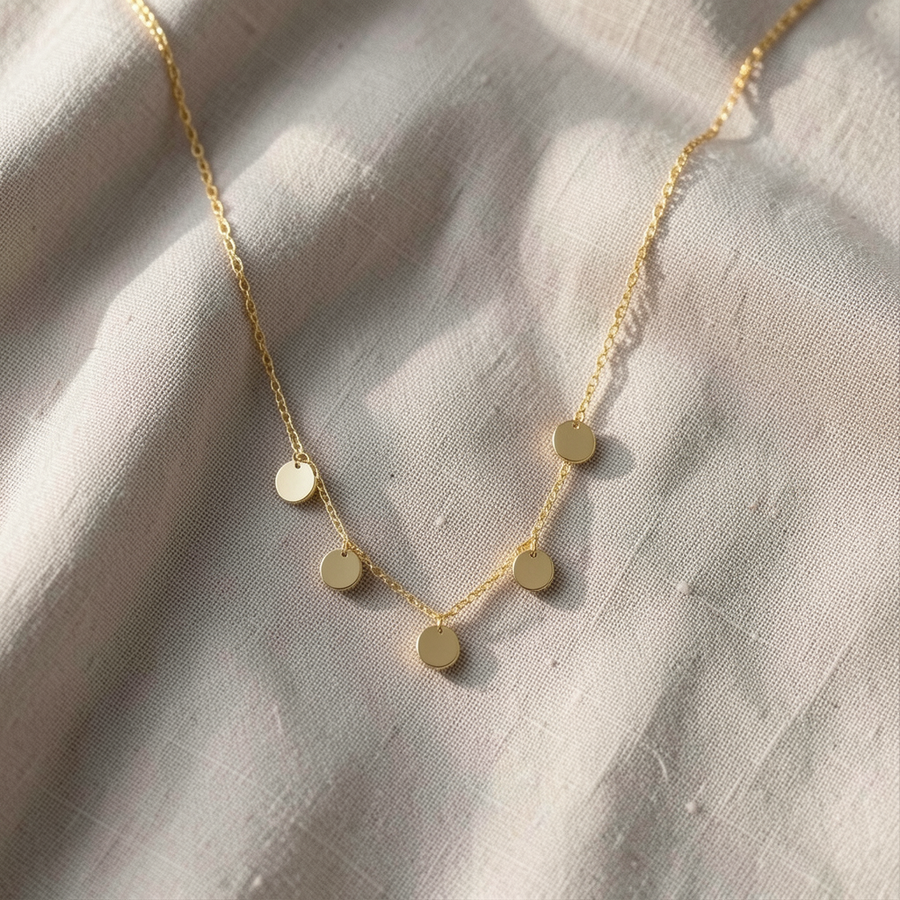 Collana dorata con dischi
