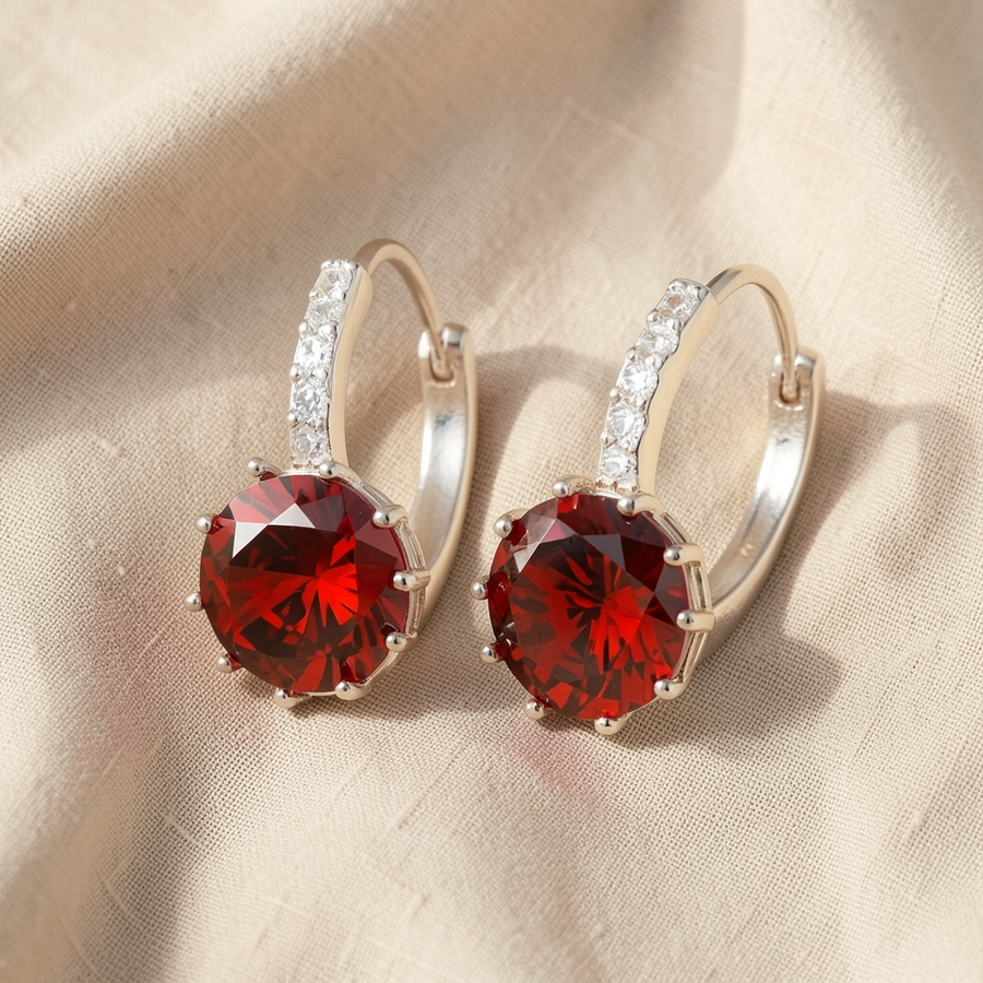 Orecchini argentati con pietra rosso rubino e zirconi
